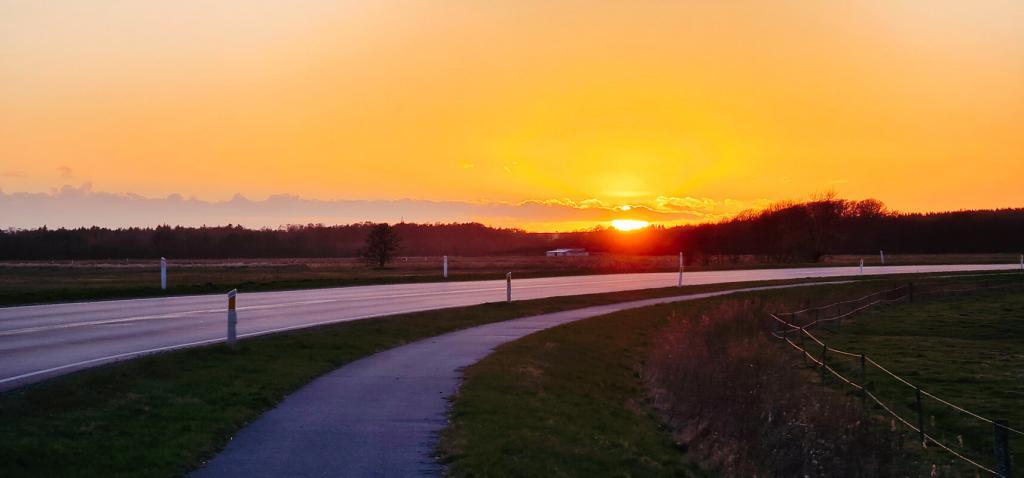 After a couple of whiskies at my parents’ house during Easter, I had to take a cab back to my condo in Grenaa, Denmark. What an evening! So told the taxi driver to take another route in order to get me this shot of a fantastic sunset.  We all know how difficult it can be to get the shot just right, but this one qualifies.
