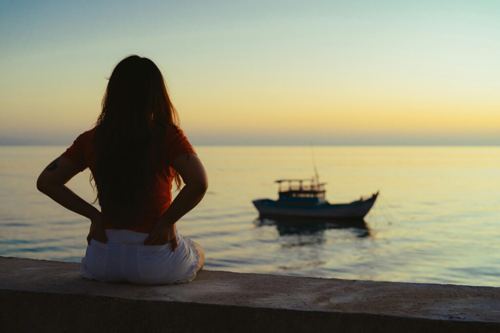 Woman looking out onto the sea